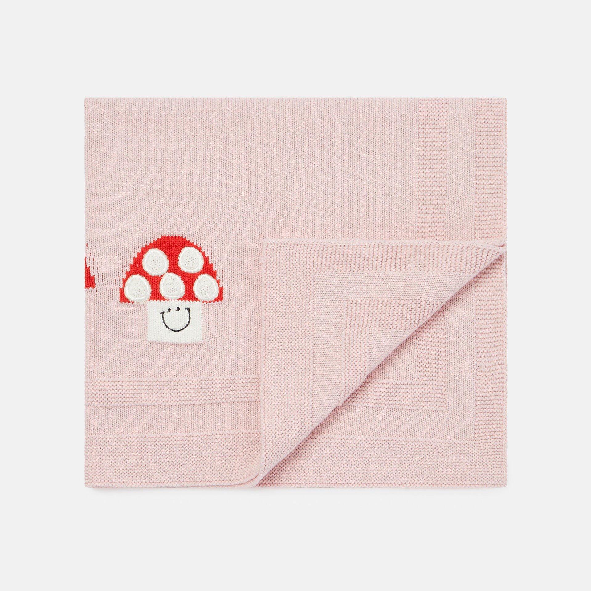 Strickdecke mit Pilz-Motiv